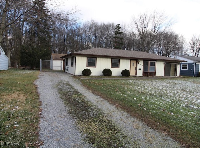 ranch-style house with a front yard