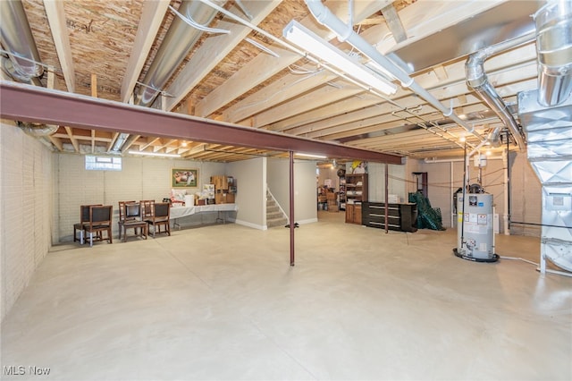 basement with brick wall and water heater