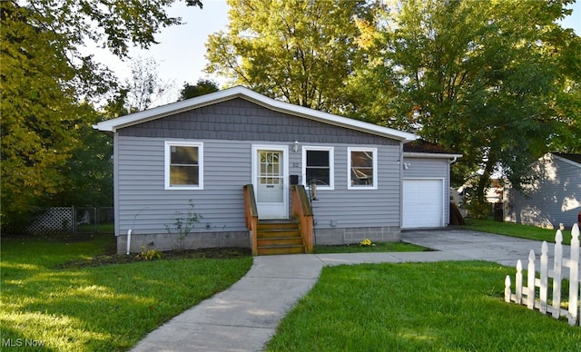 view of front of home with a garage and a front yard