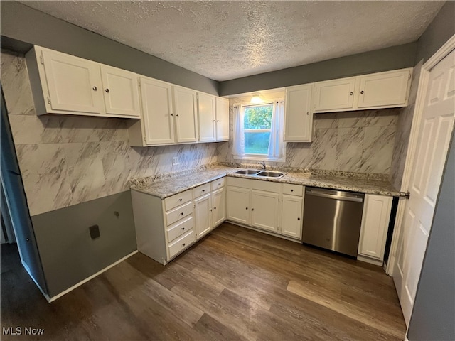 kitchen featuring sink, dishwasher, dark hardwood / wood-style floors, and white cabinets