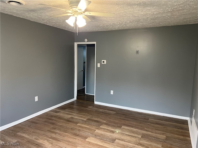 unfurnished room featuring ceiling fan, hardwood / wood-style flooring, and a textured ceiling