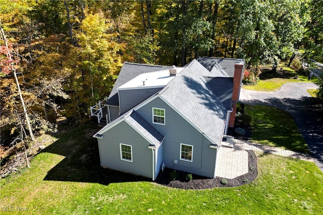 rear view of house with a yard