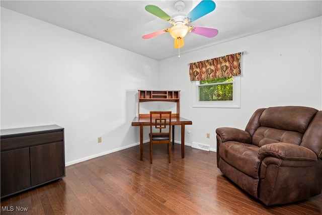 sitting room with ceiling fan and dark hardwood / wood-style flooring