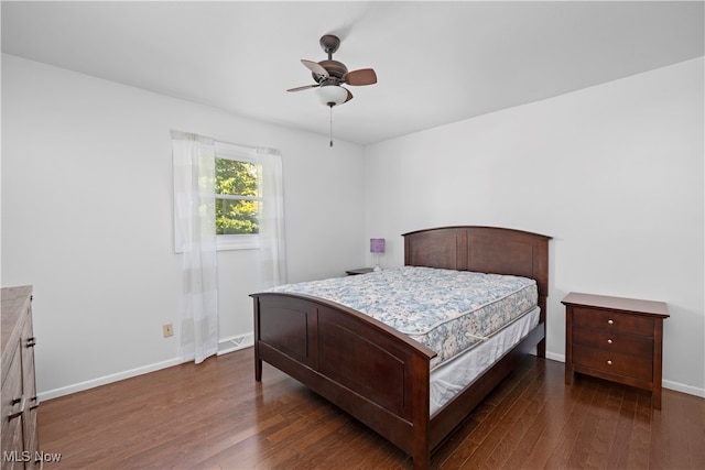 bedroom featuring ceiling fan and dark hardwood / wood-style floors