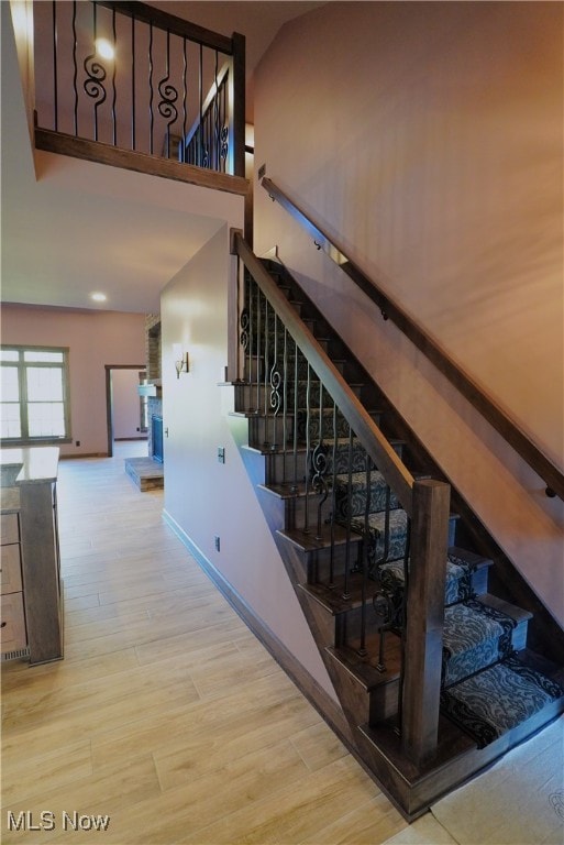 stairs with hardwood / wood-style floors