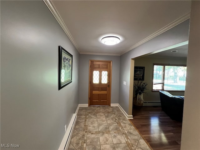 entryway with baseboard heating, crown molding, hardwood / wood-style flooring, and plenty of natural light