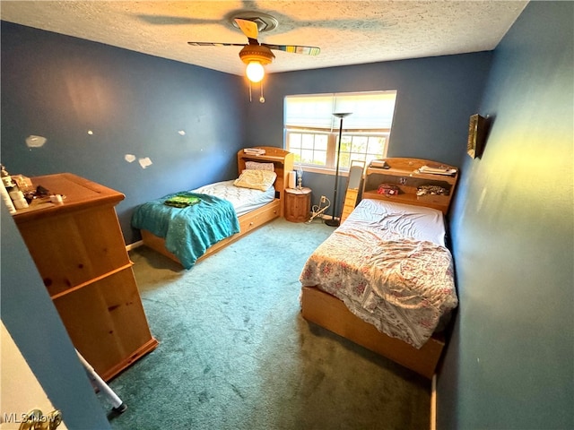 bedroom featuring a textured ceiling, carpet floors, and ceiling fan