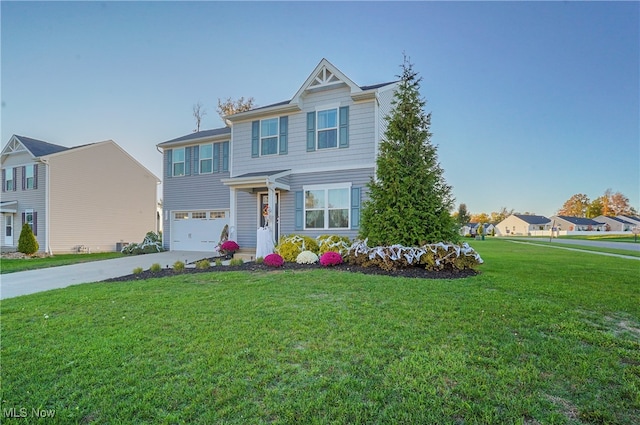 view of front of house with a front yard and a garage