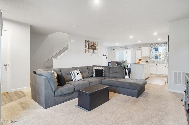 living room with light colored carpet