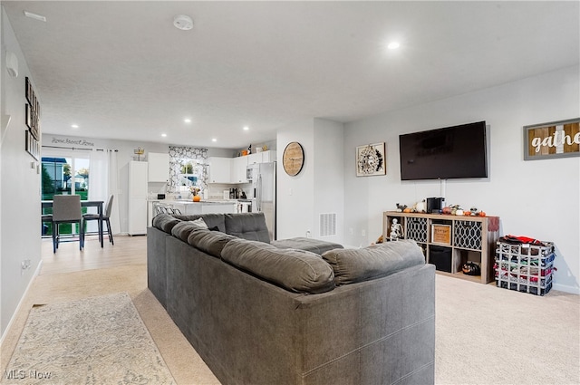 living room with light colored carpet