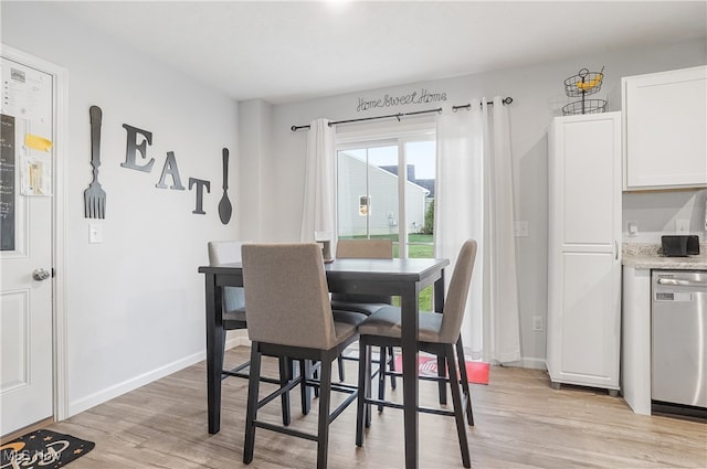 dining room with light wood-type flooring