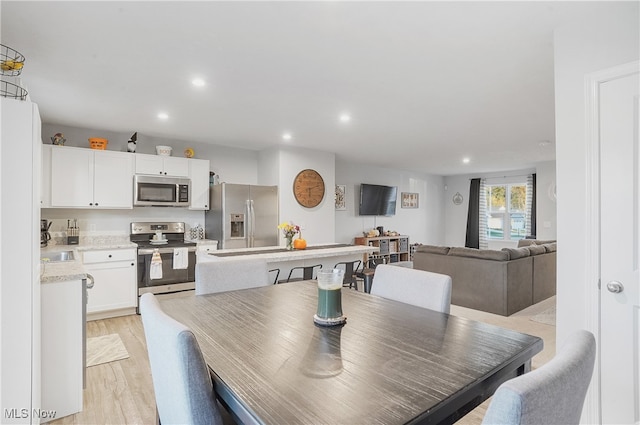 dining room featuring light hardwood / wood-style flooring