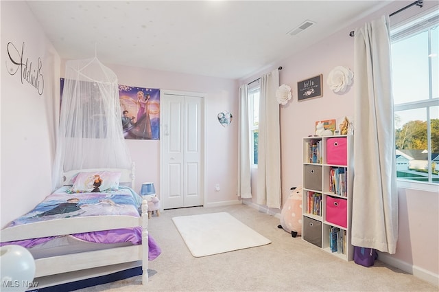 bedroom featuring a closet and carpet flooring