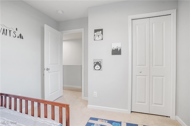 carpeted bedroom featuring a closet