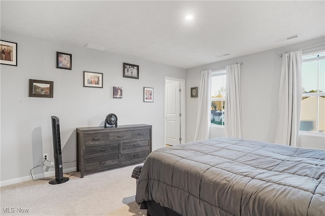 bedroom featuring light colored carpet