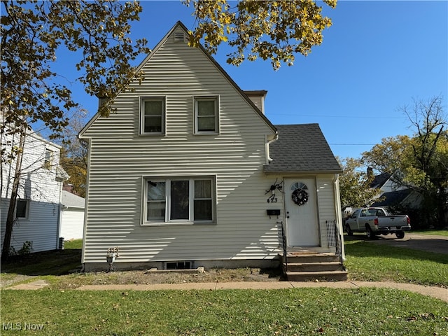 view of property featuring a front yard