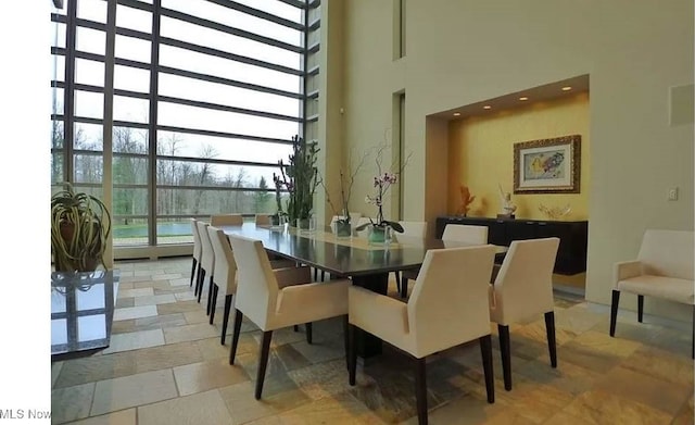 dining area with a high ceiling
