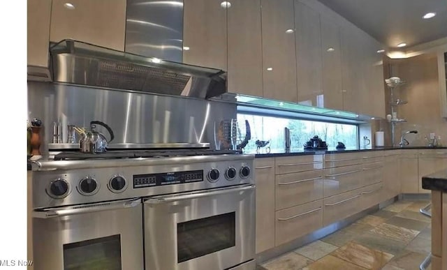 kitchen with tasteful backsplash, double oven range, and modern cabinets