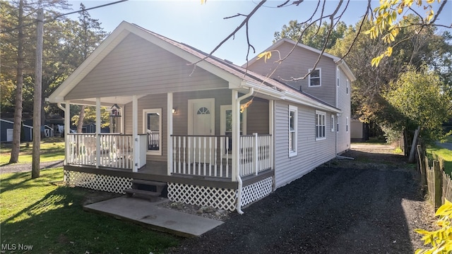 view of front facade with a front yard and a porch