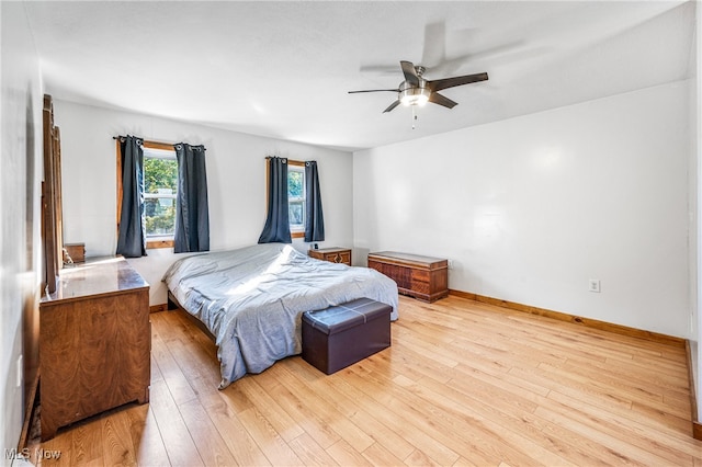 bedroom featuring light hardwood / wood-style flooring and ceiling fan