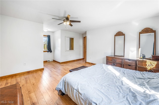 bedroom with light wood-type flooring and ceiling fan