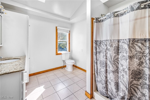 bathroom with lofted ceiling, tile patterned floors, toilet, vanity, and walk in shower