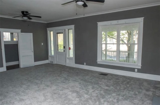 unfurnished room with ornamental molding, carpet floors, a healthy amount of sunlight, and ceiling fan