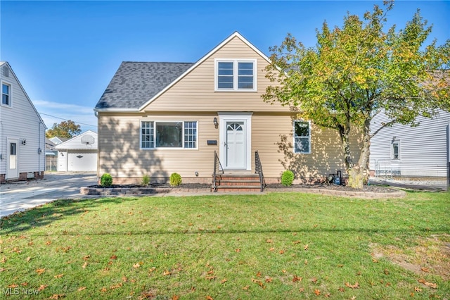 view of front of property with a front yard and a garage