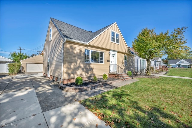 view of front of home featuring an outdoor structure, a front lawn, and a garage