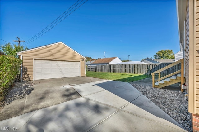 exterior space with an outbuilding and a garage