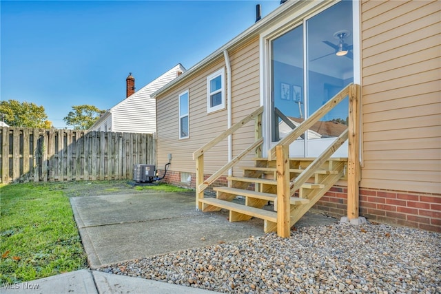 back of property featuring a patio area and cooling unit