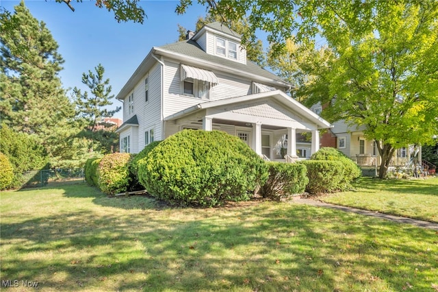 view of side of property featuring a yard