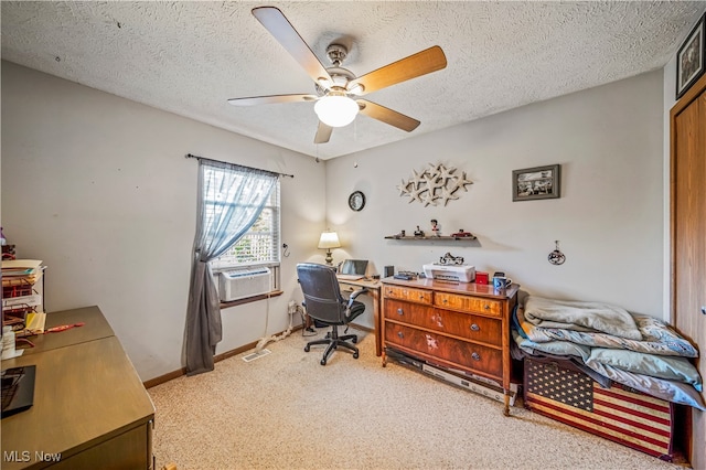 carpeted office with cooling unit, a textured ceiling, and ceiling fan