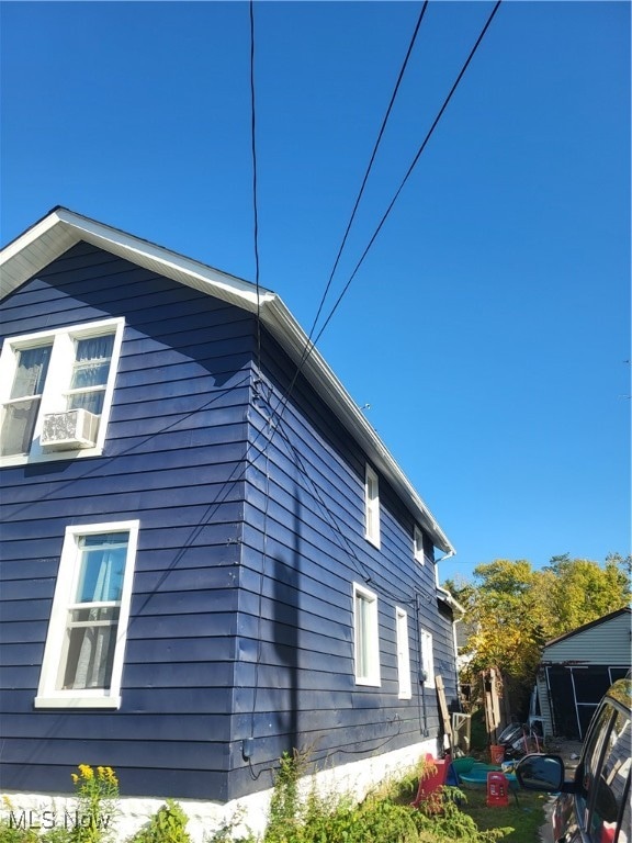 view of home's exterior with cooling unit