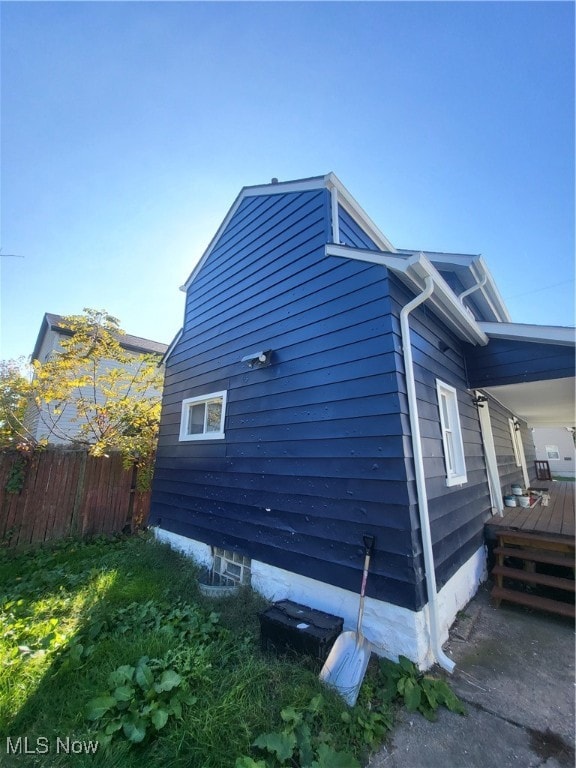 view of side of property featuring a deck