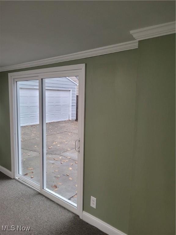 carpeted spare room with ornamental molding