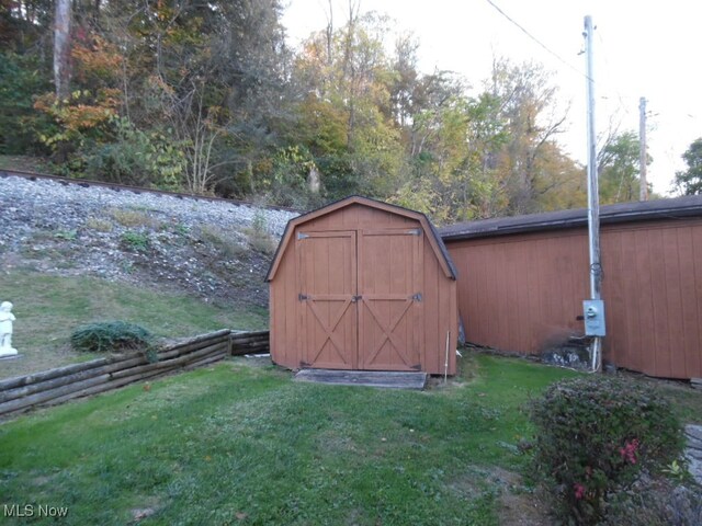 view of outdoor structure with a lawn