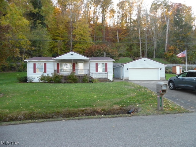 ranch-style home featuring a front yard, an outdoor structure, a garage, and a porch