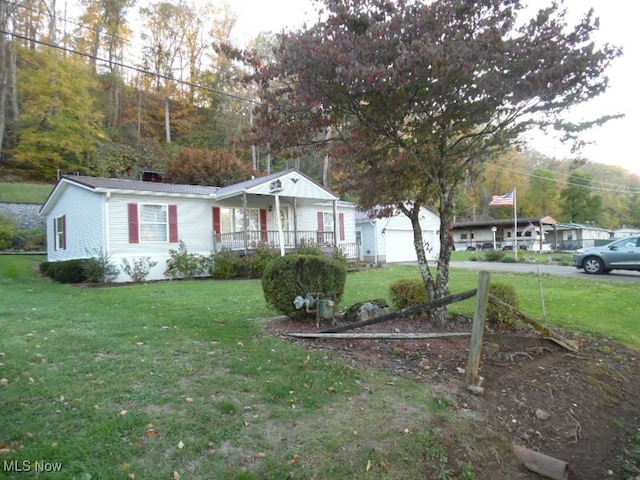 view of front of home featuring a front yard and a porch