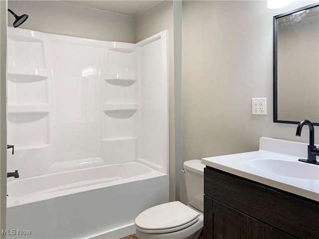 full bathroom with toilet, vanity, and  shower combination