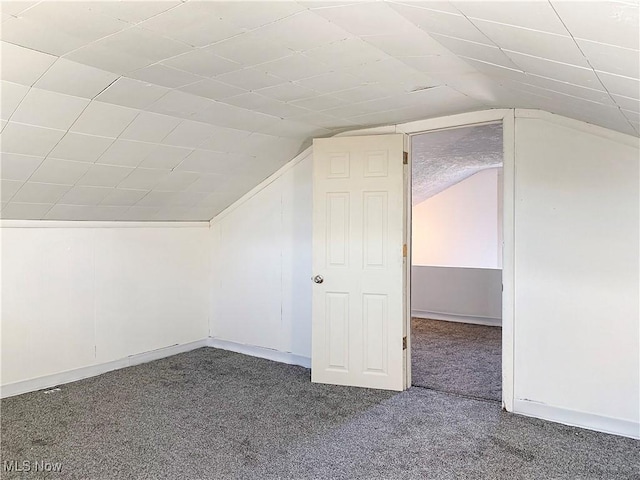 bonus room featuring carpet and lofted ceiling