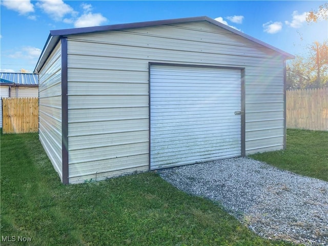 view of outdoor structure with a lawn