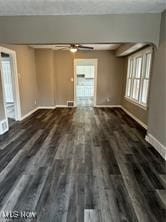 unfurnished room featuring dark hardwood / wood-style floors