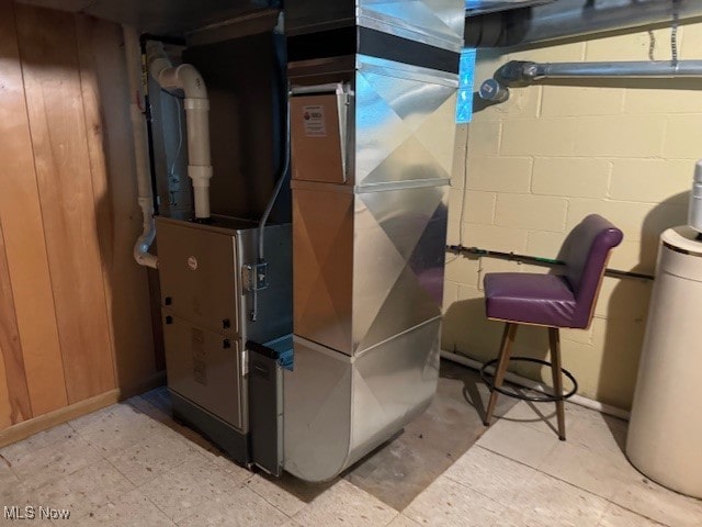 utility room featuring heating unit