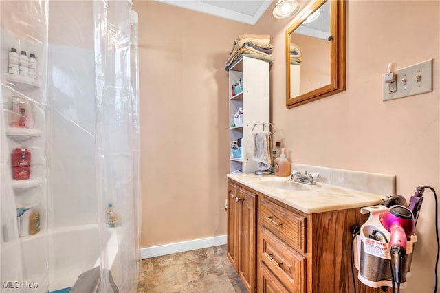 bathroom featuring vanity, ornamental molding, and shower / bath combo