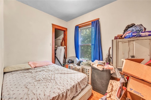 bedroom with hardwood / wood-style floors