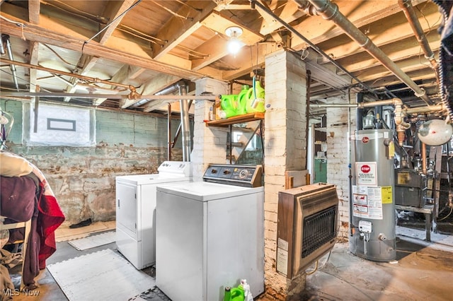 laundry room with water heater, heating unit, and separate washer and dryer