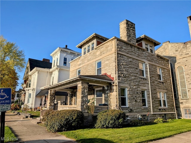 exterior space featuring a front lawn