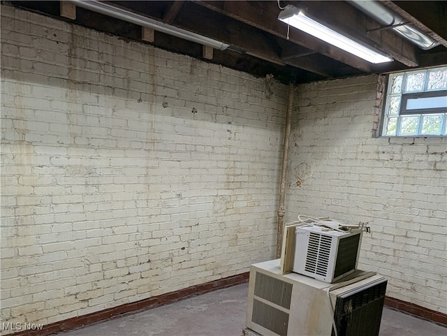 basement with brick wall