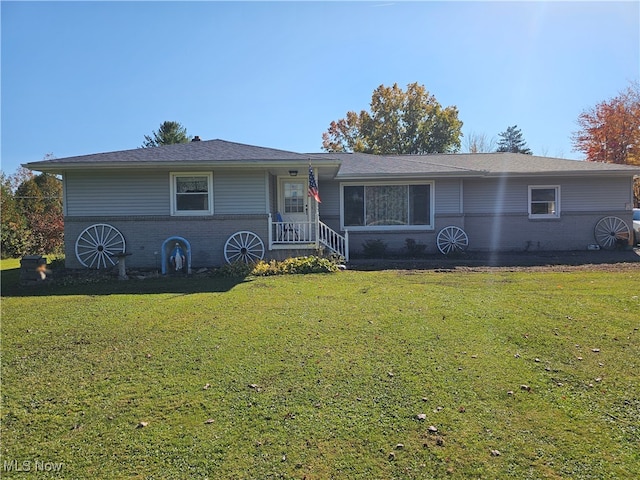 ranch-style home with a front lawn